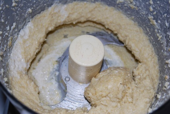 Process cashews into a flour using your food processor, slowly add water until it reaches a creamy consistency. (This was before I added more water to make it smooth)